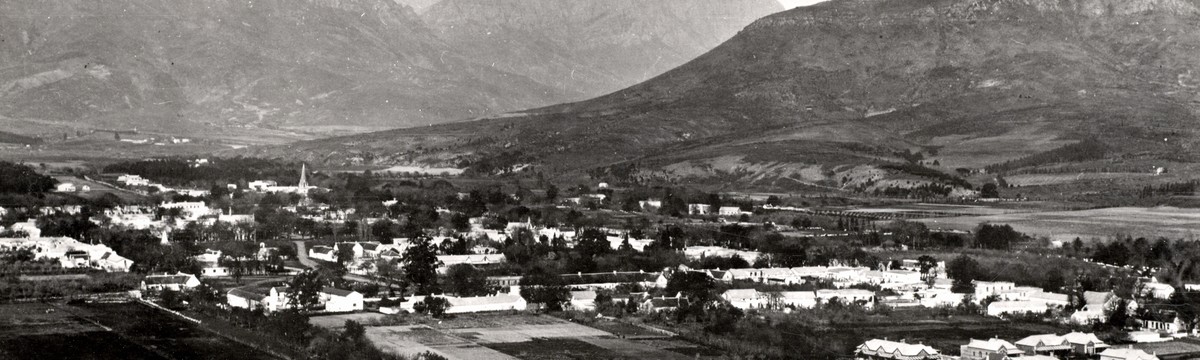 Panoramic view of Stellenbosch, the town below the mountains. Western Cape Archives and Records Service.